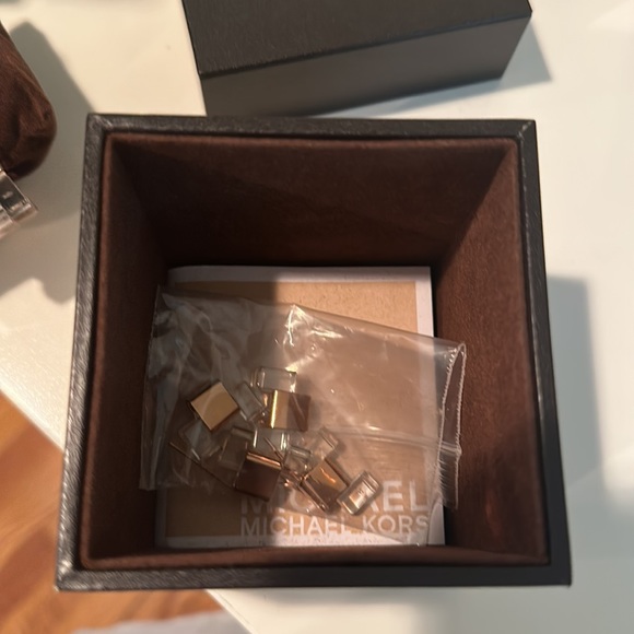 Michael Kor’s clear and rose gold crystal dial Watch